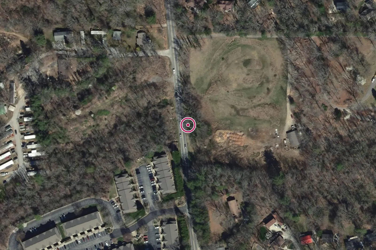 Aerial view around 3124 Sweeten Creek Road, with a circle at the address.