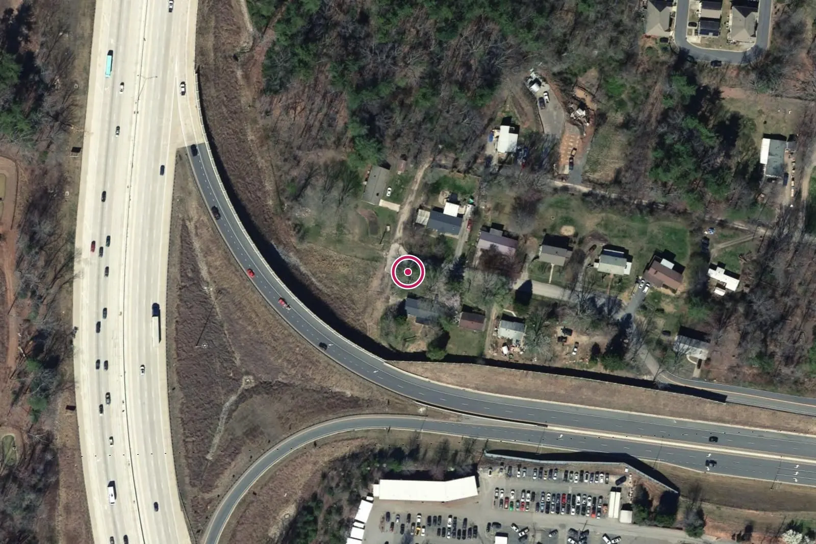 Aerial view around 36 Pine Lane, with a circle at the address.